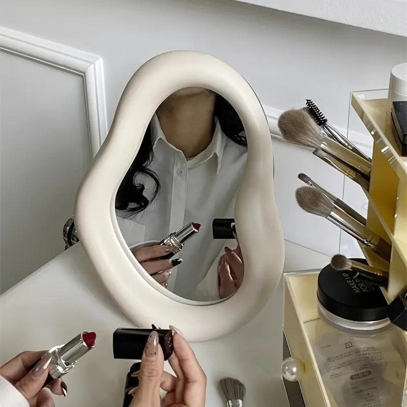 Irregular cosmetic mirror