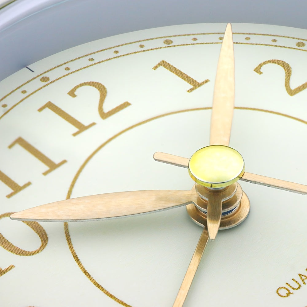 Round travel alarm clock with a light