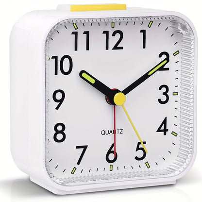 Travel alarm clock with luminous hands