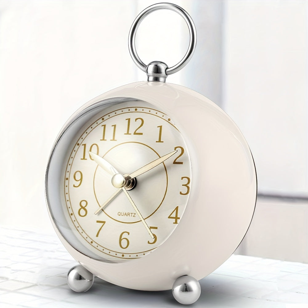 Round travel alarm clock with a light