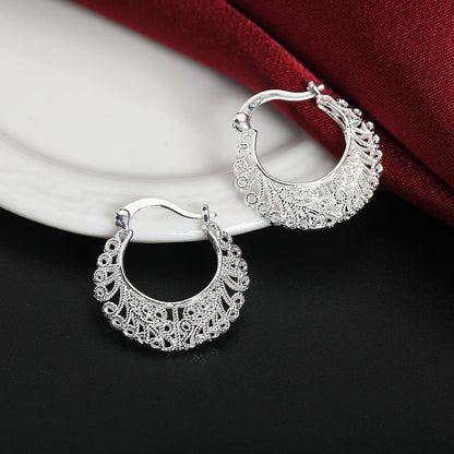 Boucles d’oreilles créoles à motif floral