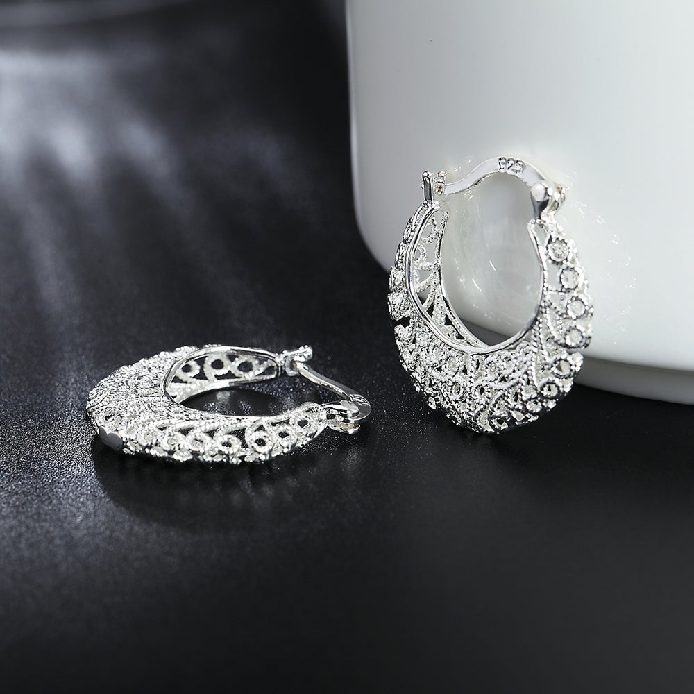 Boucles d’oreilles créoles à motif floral