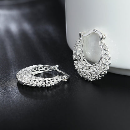 Boucles d’oreilles créoles à motif floral