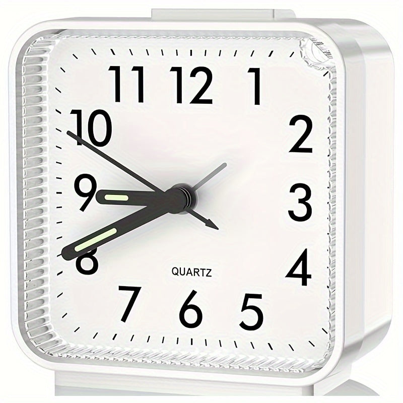 Travel alarm clock with illuminated hands