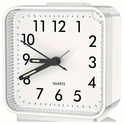 Travel alarm clock with illuminated hands