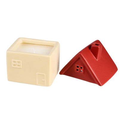 Pink candle in a little house