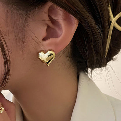 Clous d’oreilles cœur bicolores