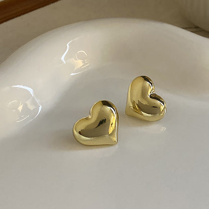 Clous d’oreilles cœur bicolores