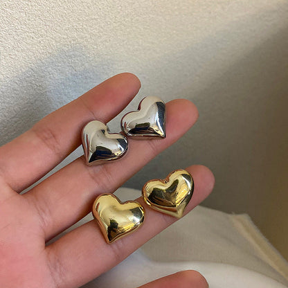 Clous d’oreilles cœur bicolores