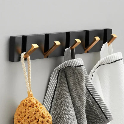 Wall-mounted coat rack with folding hooks