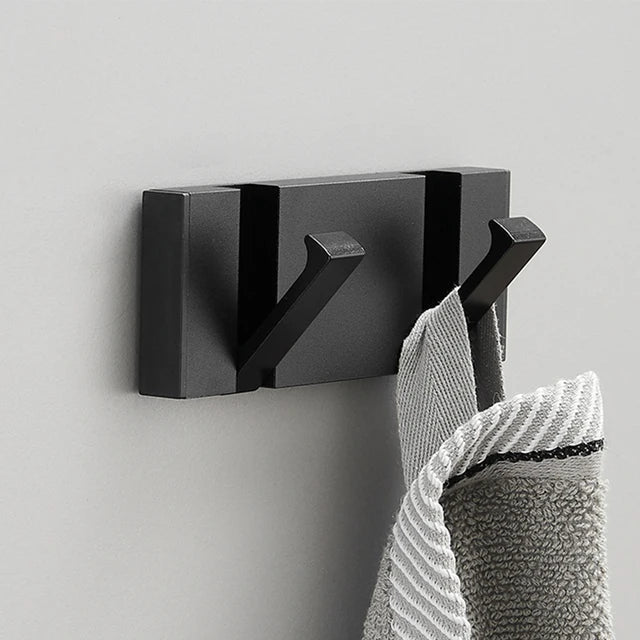 Wall-mounted coat rack with folding hooks