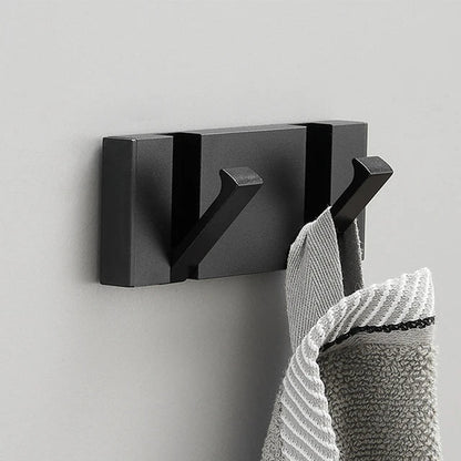 Wall-mounted coat rack with folding hooks