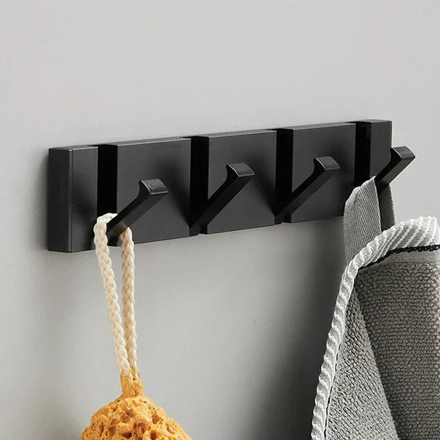 Wall-mounted coat rack with folding hooks