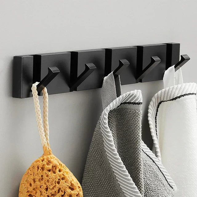 Wall-mounted coat rack with folding hooks