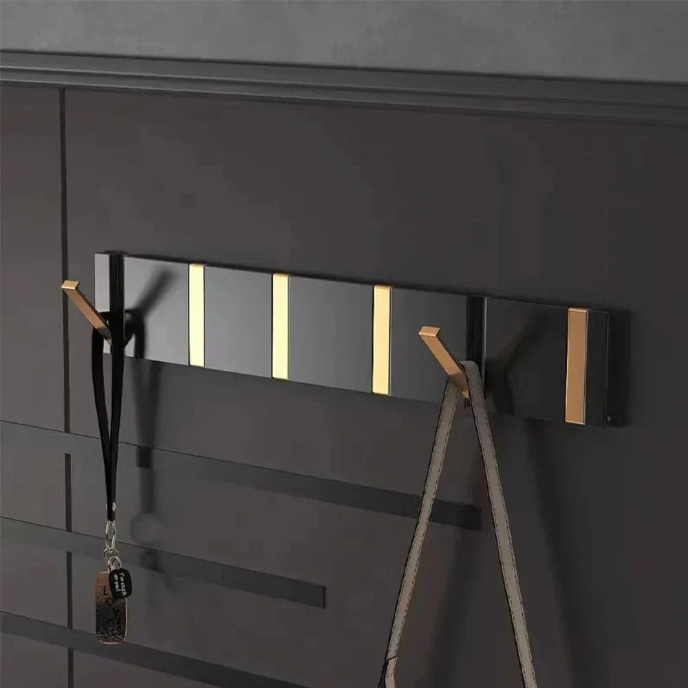 Wall-mounted coat rack with folding hooks