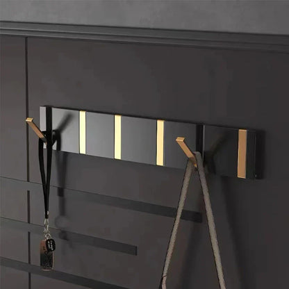 Wall-mounted coat rack with folding hooks