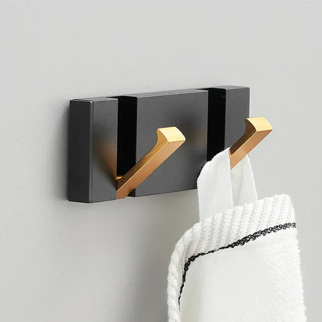 Wall-mounted coat rack with folding hooks