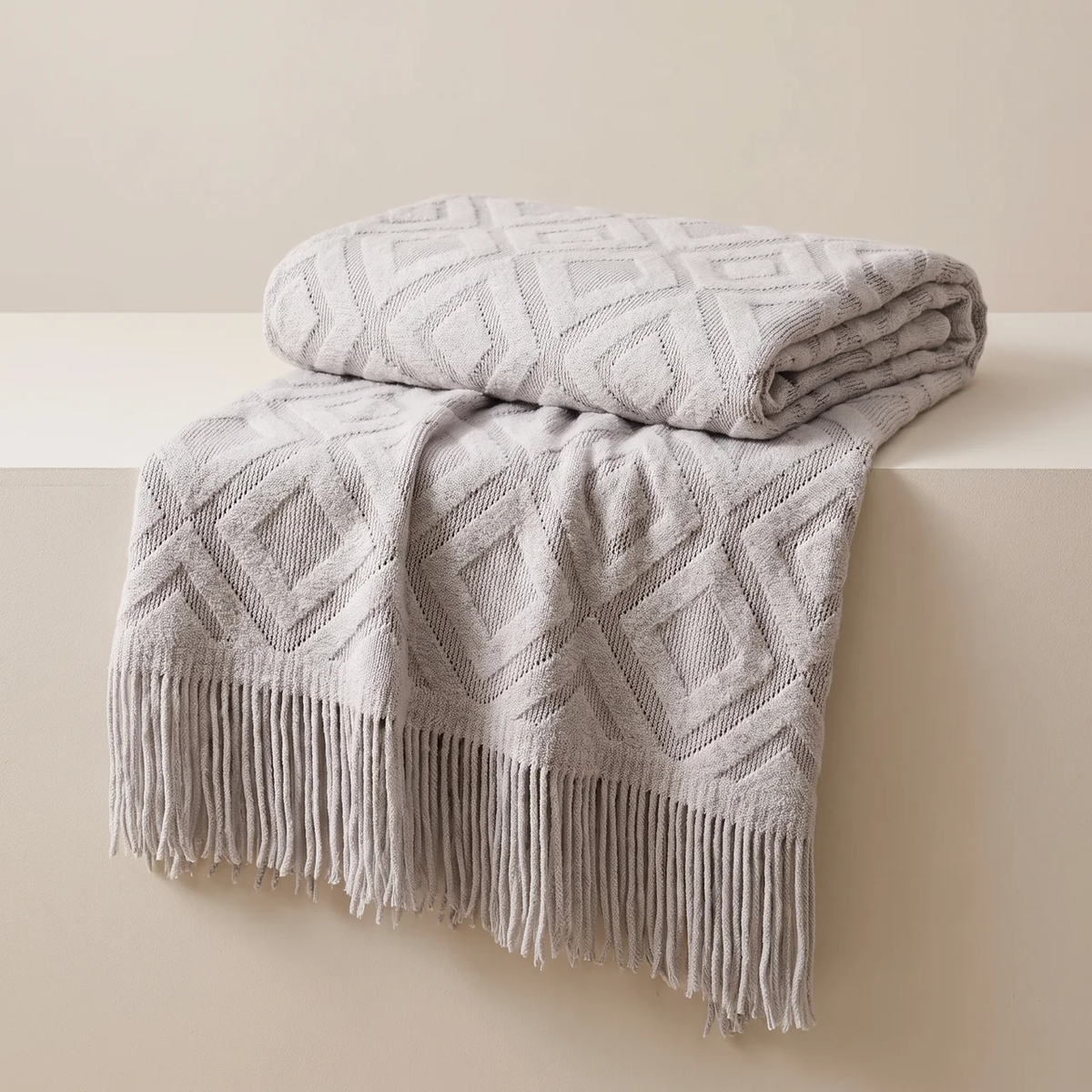 Fringed throw blanket