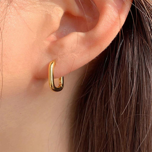 Clous d’oreilles géométriques dorés