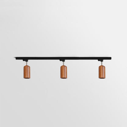 Lampa szynowa z drewnianymi kloszami