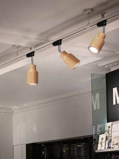 Lampa szynowa z drewnianymi kloszami
