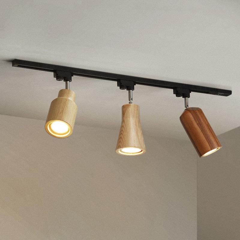 Lampa szynowa z drewnianymi kloszami