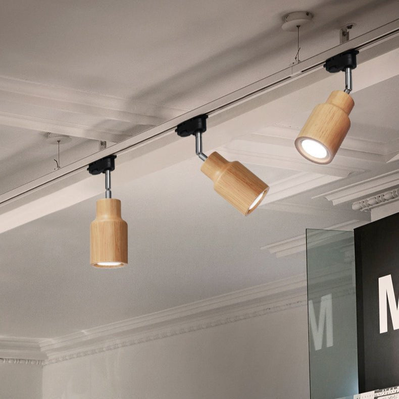 Lampa szynowa z drewnianymi kloszami
