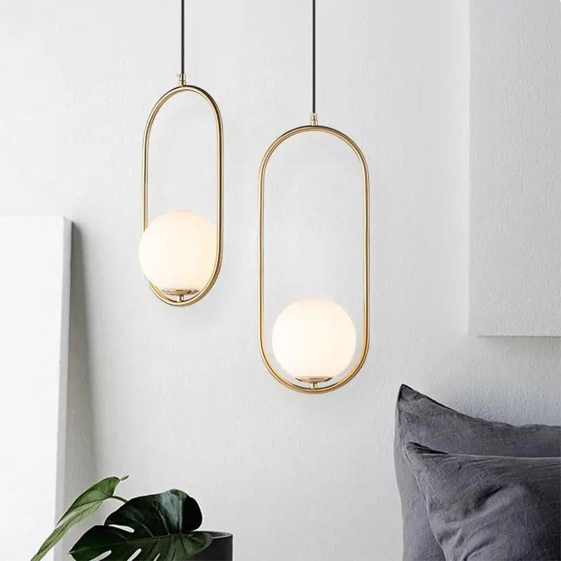 Oval pendant lamp with a globe