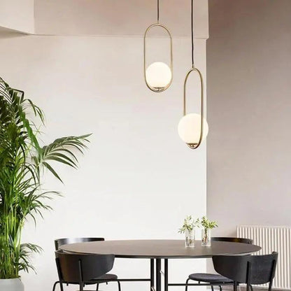 Oval pendant lamp with a globe