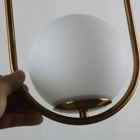 Oval pendant lamp with a globe