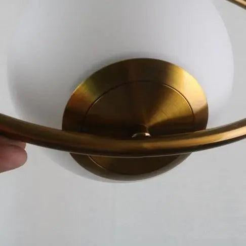 Oval pendant lamp with a globe